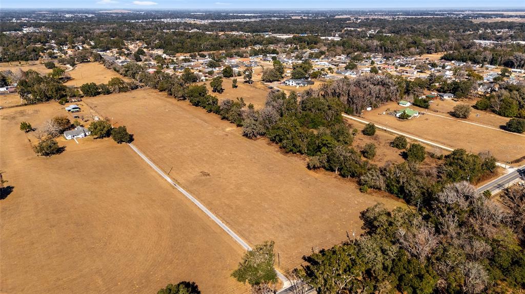 4101 Southeast 110th Street Belleview, FL 34420 - Photo 9 of 20 an aerial view of residential houses with outdoor space