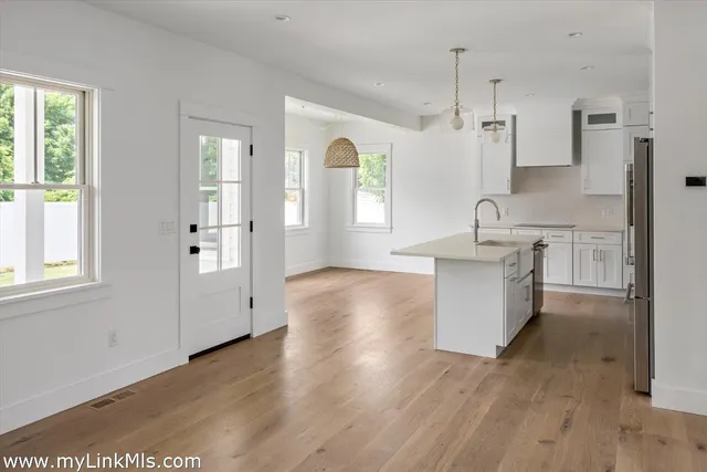 a kitchen with sink cabinets and window