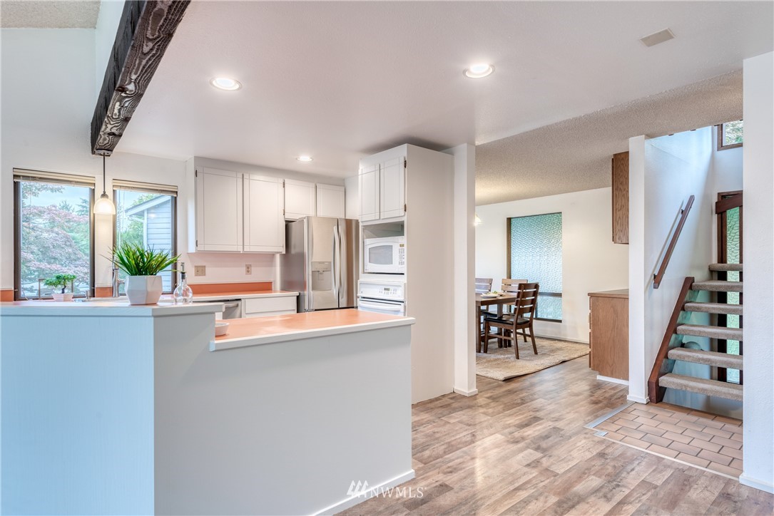 12216 Southeast 258 Place Kent, WA 98030 - Photo 15 of 40 a kitchen with sink cabinets and window