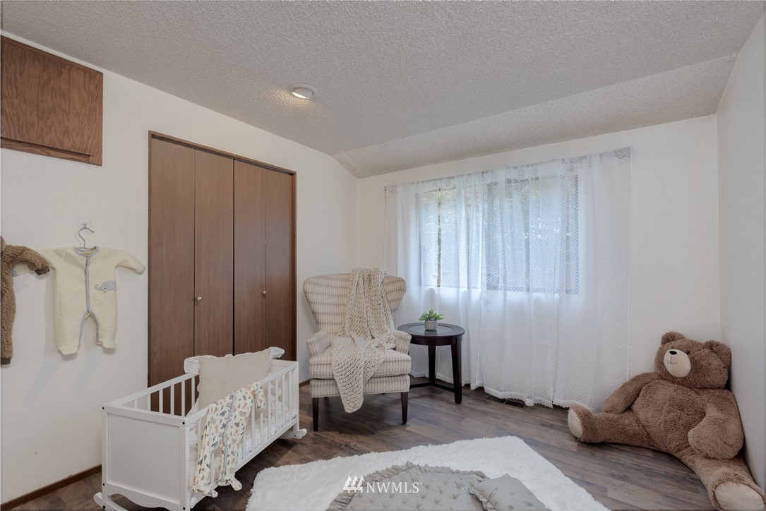 12216 Southeast 258 Place Kent, WA 98030 - Photo 23 of 40 a living room with furniture and a window