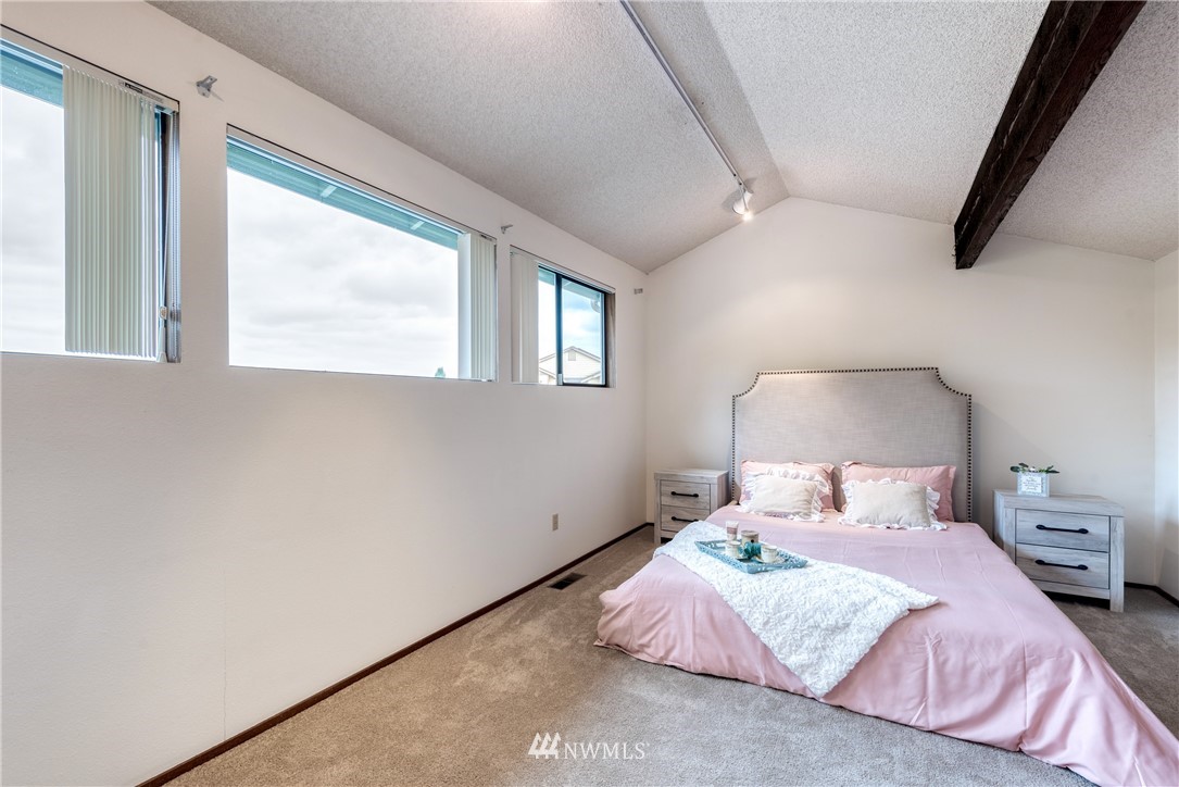 12216 Southeast 258 Place Kent, WA 98030 - Photo 28 of 40 a bedroom with a bed and window
