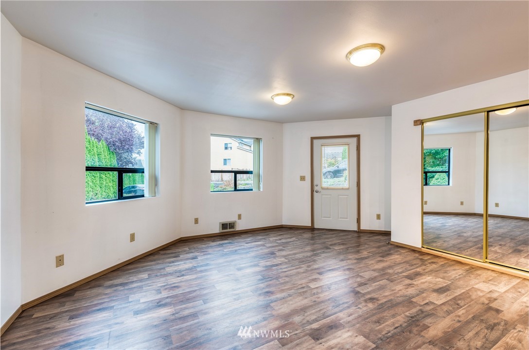 12216 Southeast 258 Place Kent, WA 98030 - Photo 32 of 40 an empty room with windows and entrance
