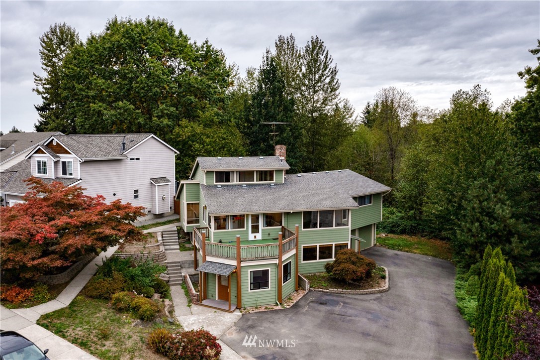 12216 Southeast 258 Place Kent, WA 98030 - Photo 40 of 40 an aerial view of a house with a yard and large trees