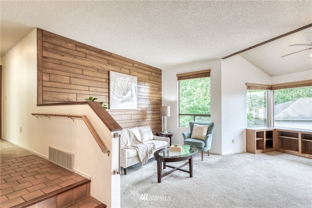 12216 Southeast 258 Place Kent, WA 98030 - Photo 4 of 40 a view of a livingroom with furniture wooden floor and windows