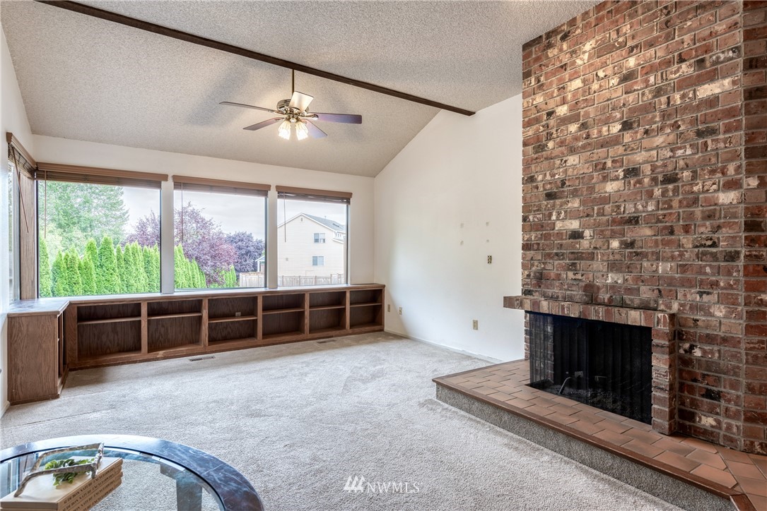12216 Southeast 258 Place Kent, WA 98030 - Photo 5 of 40 an empty room with furniture wooden floor and fan