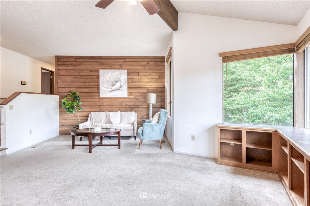 12216 Southeast 258 Place Kent, WA 98030 - Photo 6 of 40 a living room with furniture a rug and a window