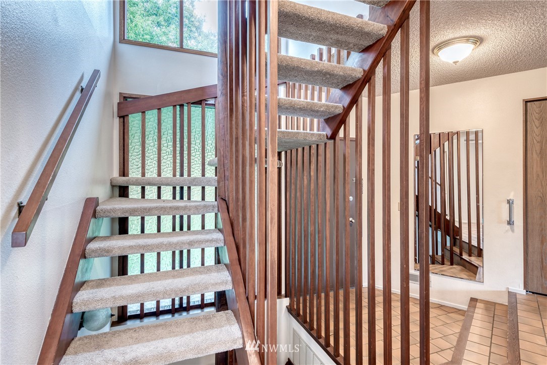 12216 Southeast 258 Place Kent, WA 98030 - Photo 9 of 40 a view of staircase with white walls and a window