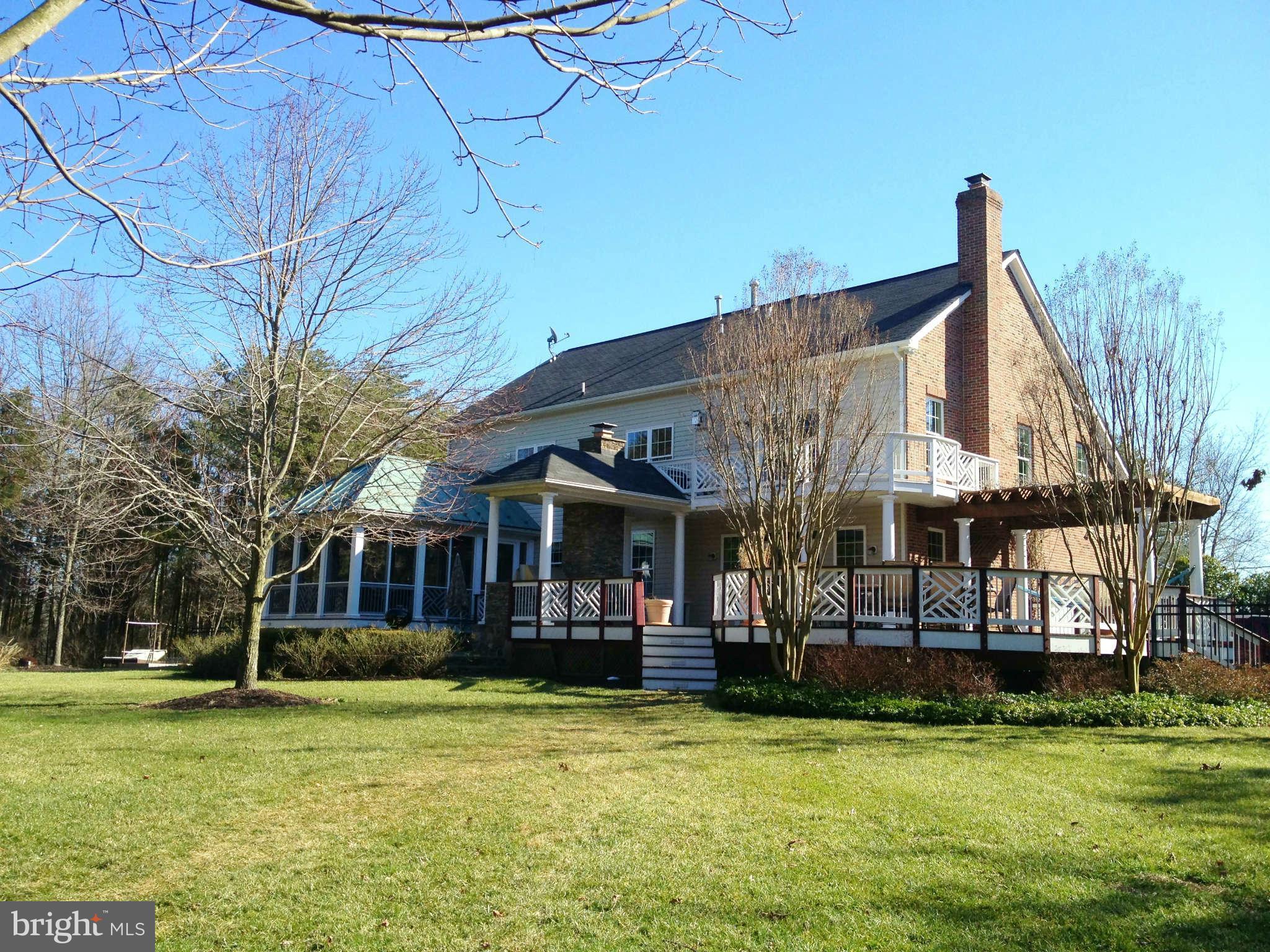 24904 Frederick Road Clarksburg, MD 20871 - Photo 2 of 30 a view of a building with a swimming pool