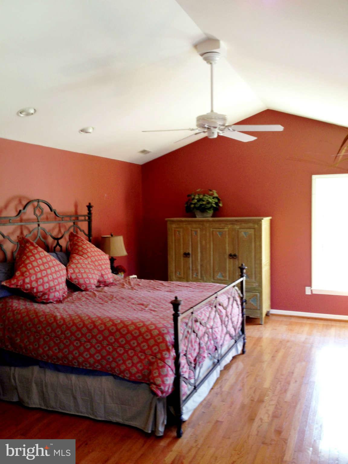 24904 Frederick Road Clarksburg, MD 20871 - Photo 16 of 30 a bedroom with a bed and a night stand