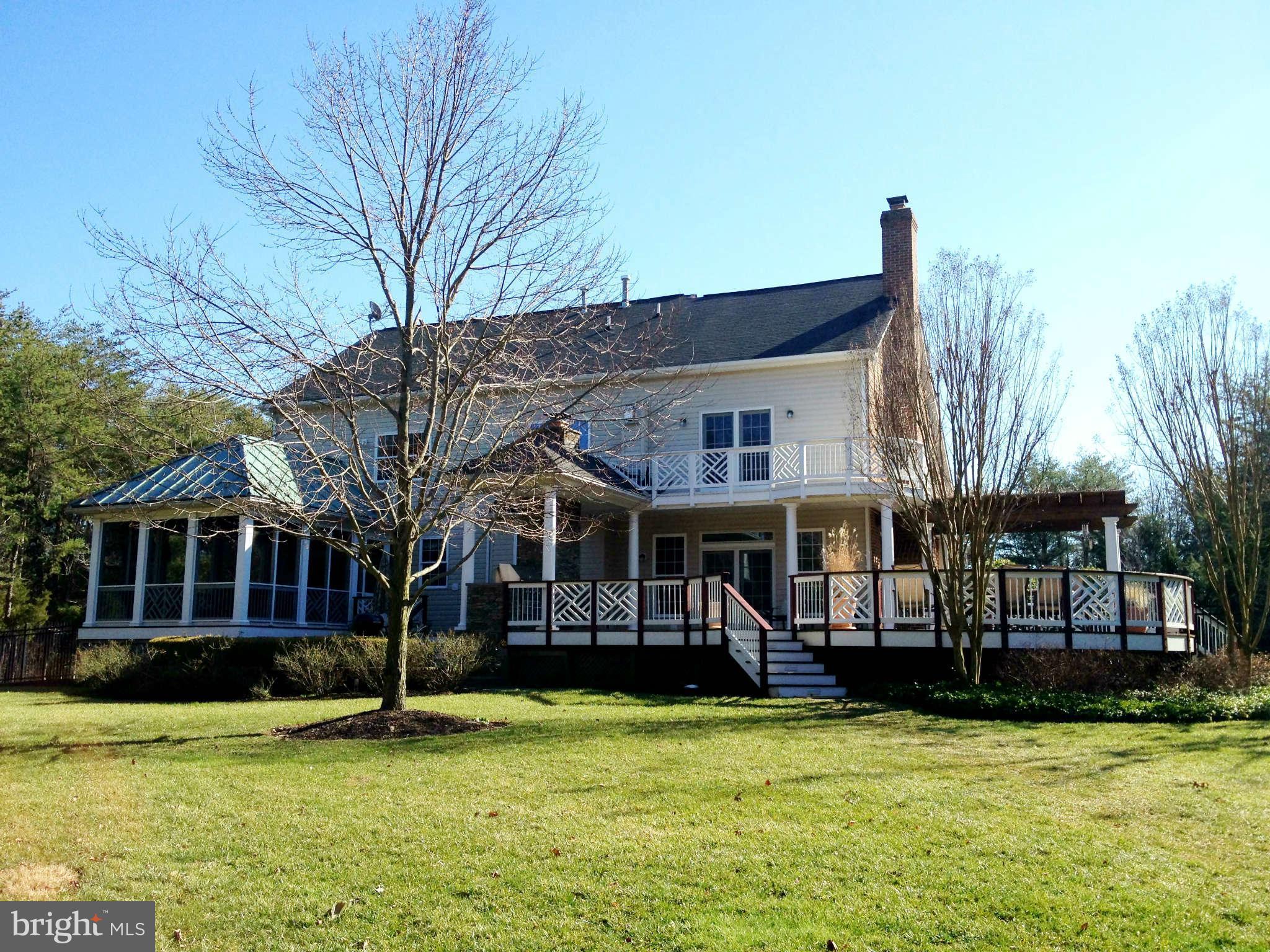 24904 Frederick Road Clarksburg, MD 20871 - Photo 3 of 30 a view of a building with a swimming pool