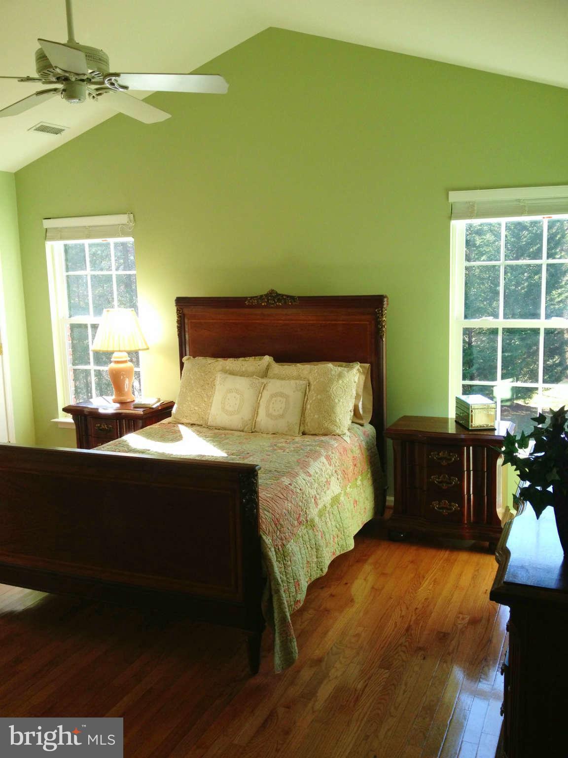 24904 Frederick Road Clarksburg, MD 20871 - Photo 23 of 30 a bed sitting in a bedroom next to a window