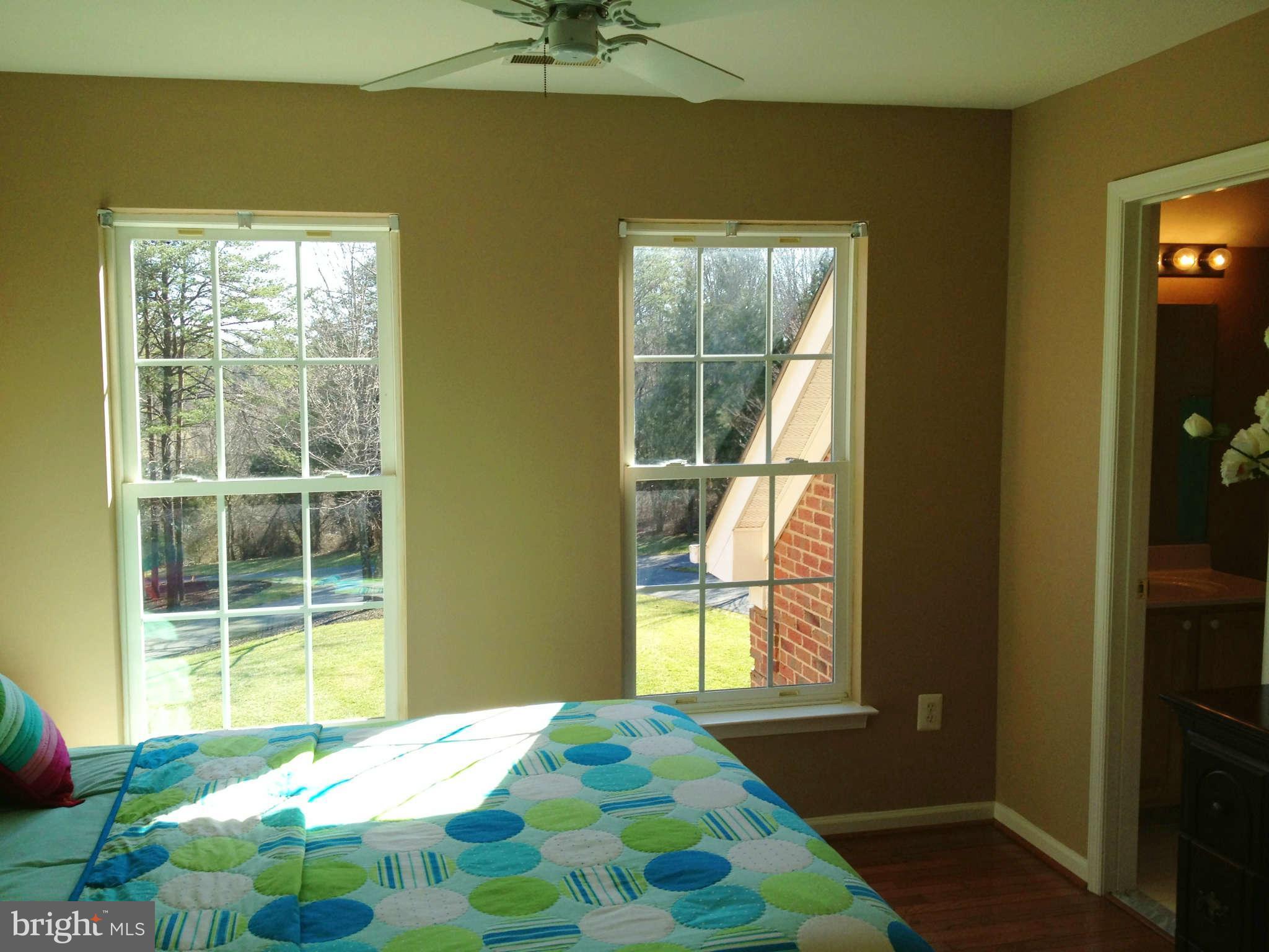 24904 Frederick Road Clarksburg, MD 20871 - Photo 24 of 30 a bedroom with a bed and a window