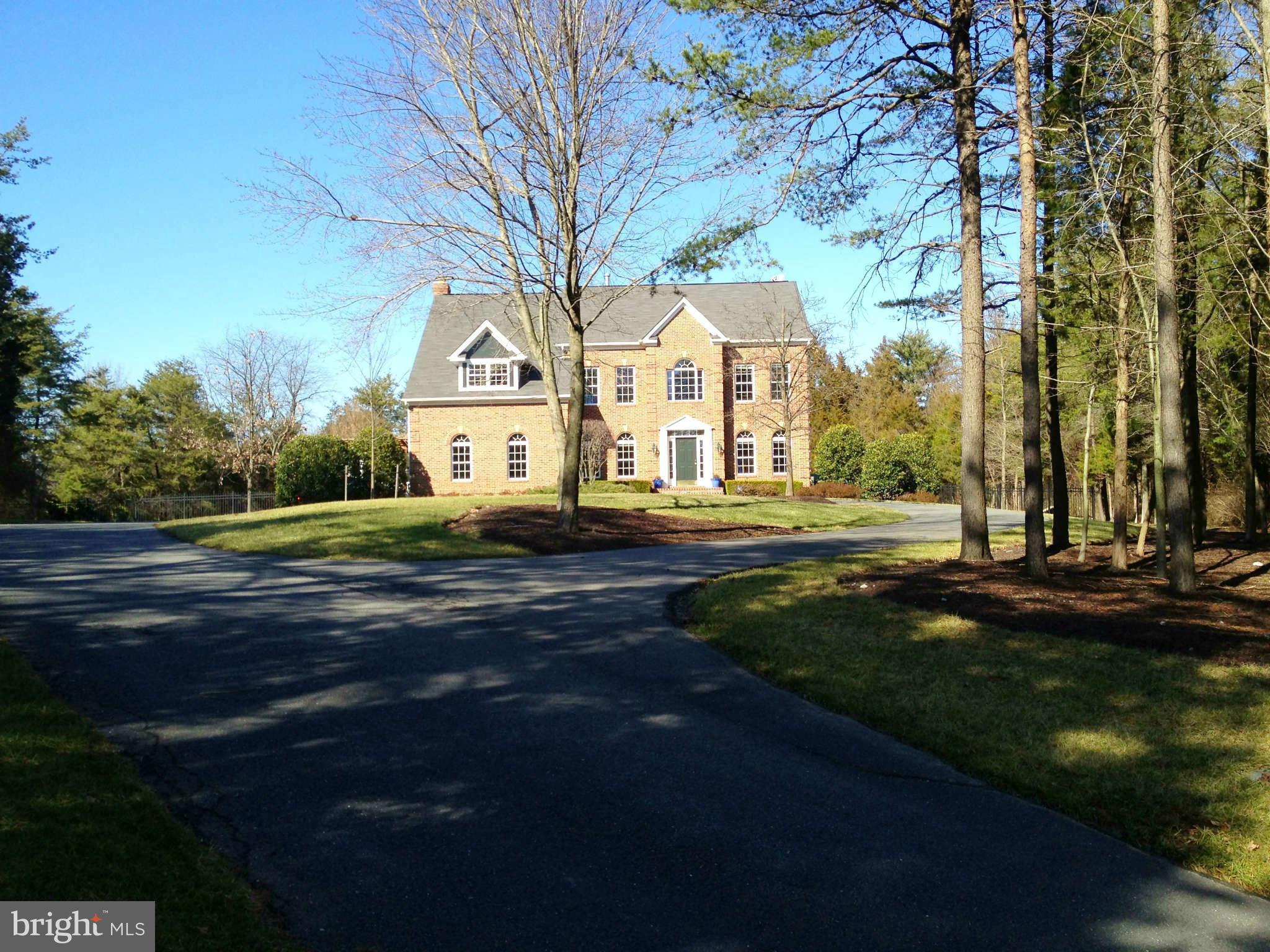 24904 Frederick Road Clarksburg, MD 20871 - Photo 30 of 30 a front view of a house with a garden