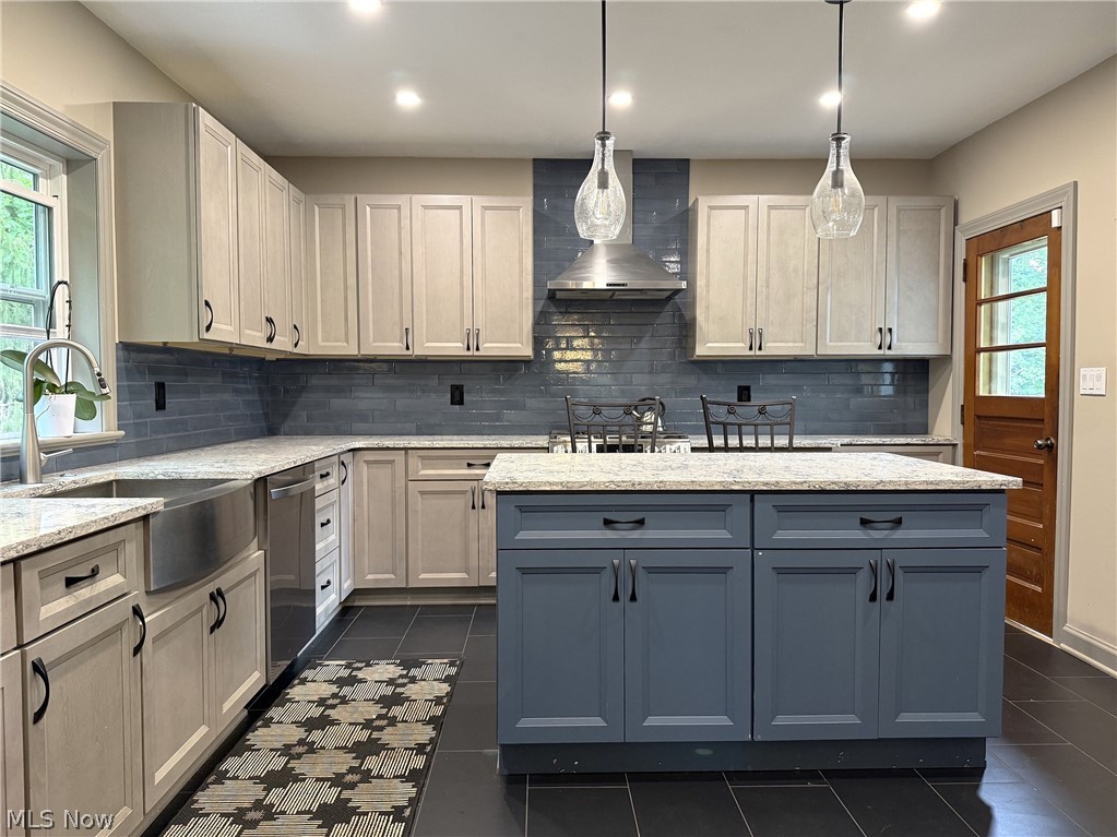 10990 Mayfield Road Chardon, OH 44024 - Photo 4 of 28 Center Island with a Breakfast Bar, for added countertop space. Beautiful porcelain tile floor.