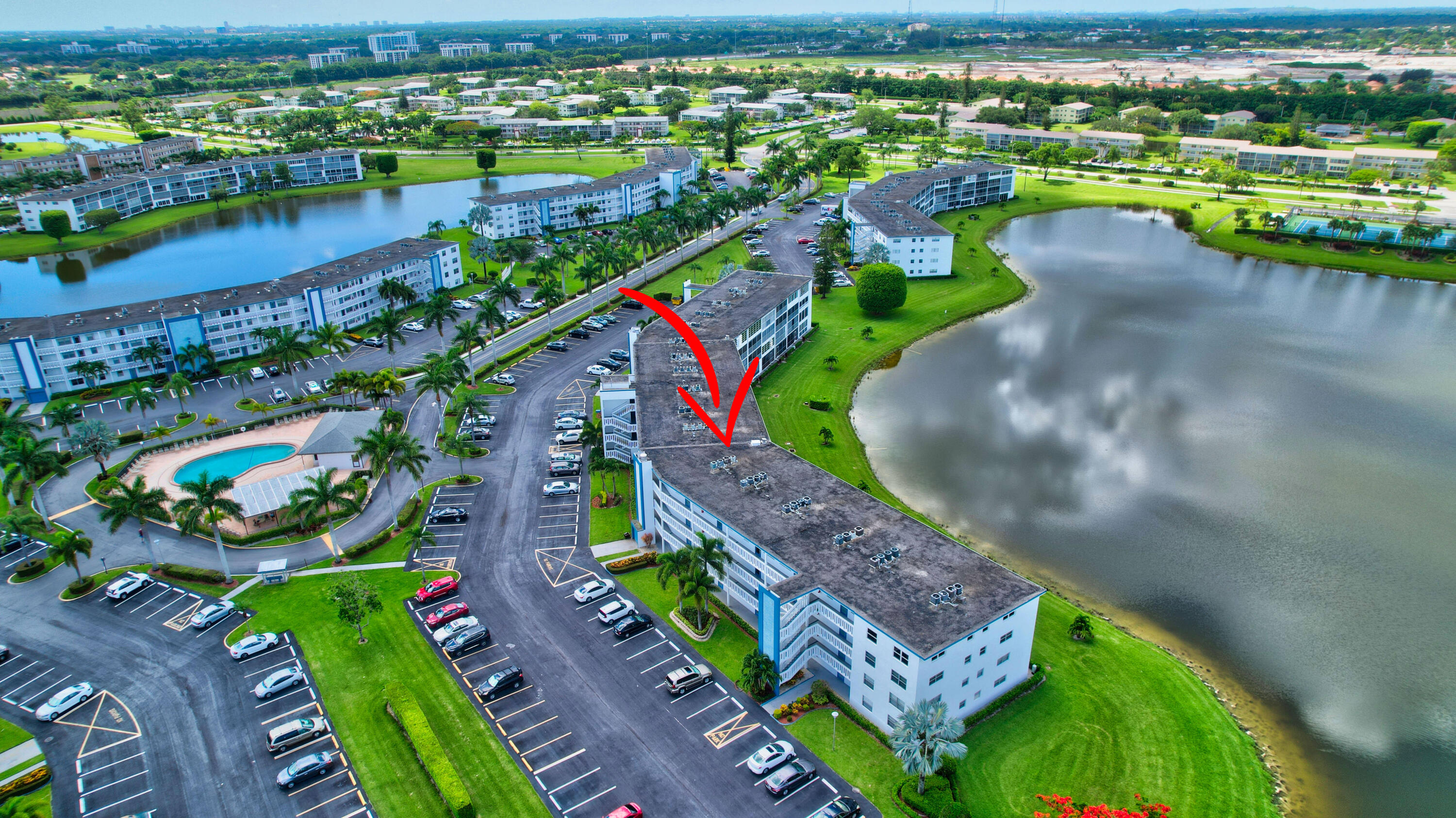 3063 Exeter, Unit 3063 Boca Raton, FL 33434 - Photo 2 of 57 Aerial lake view & subdivision pool