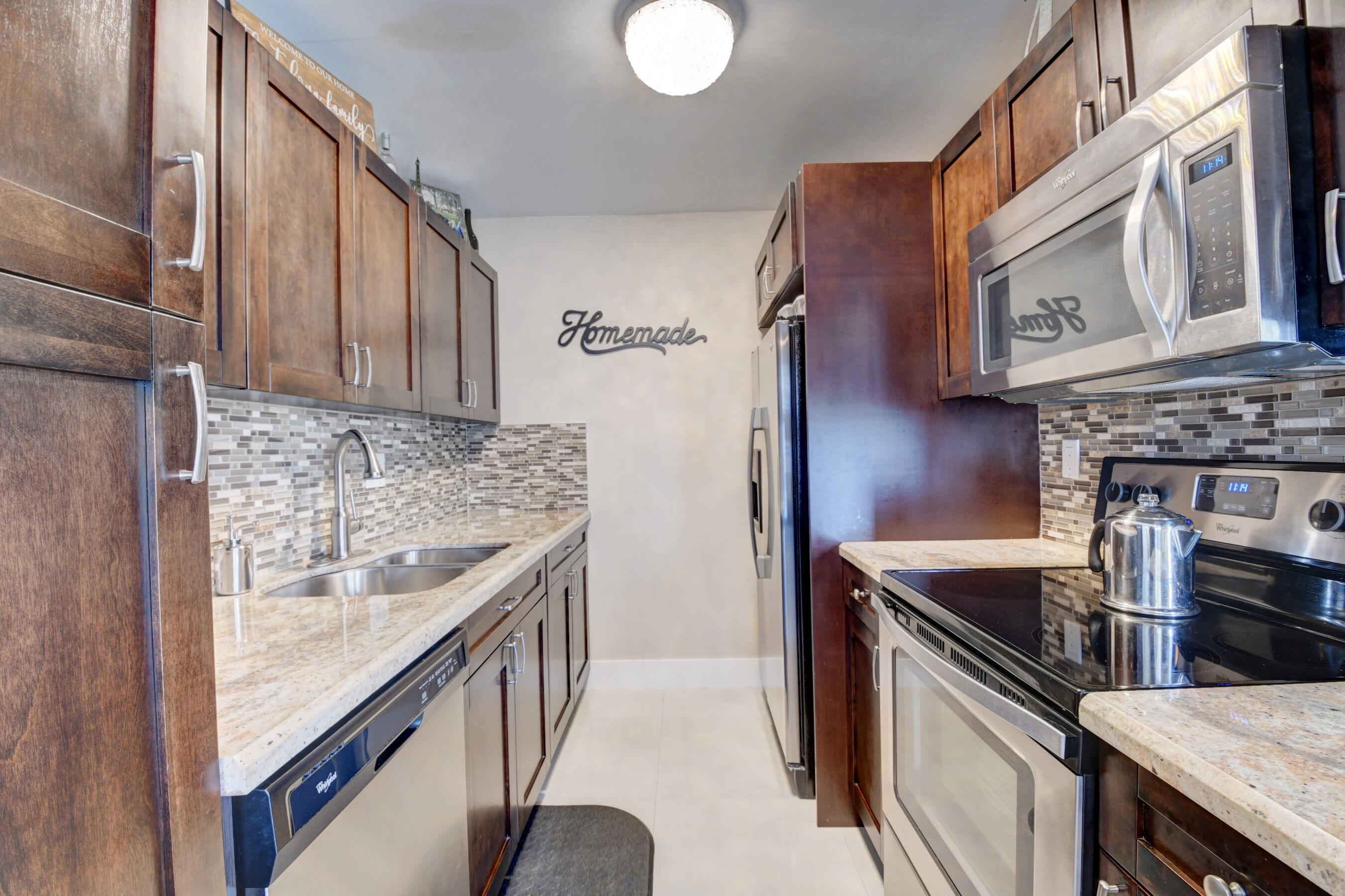 3063 Exeter, Unit 3063 Boca Raton, FL 33434 - Photo 4 of 57 Wood cabinets, tile backsplash