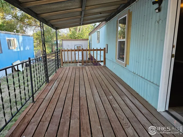 a view of balcony with wooden floor