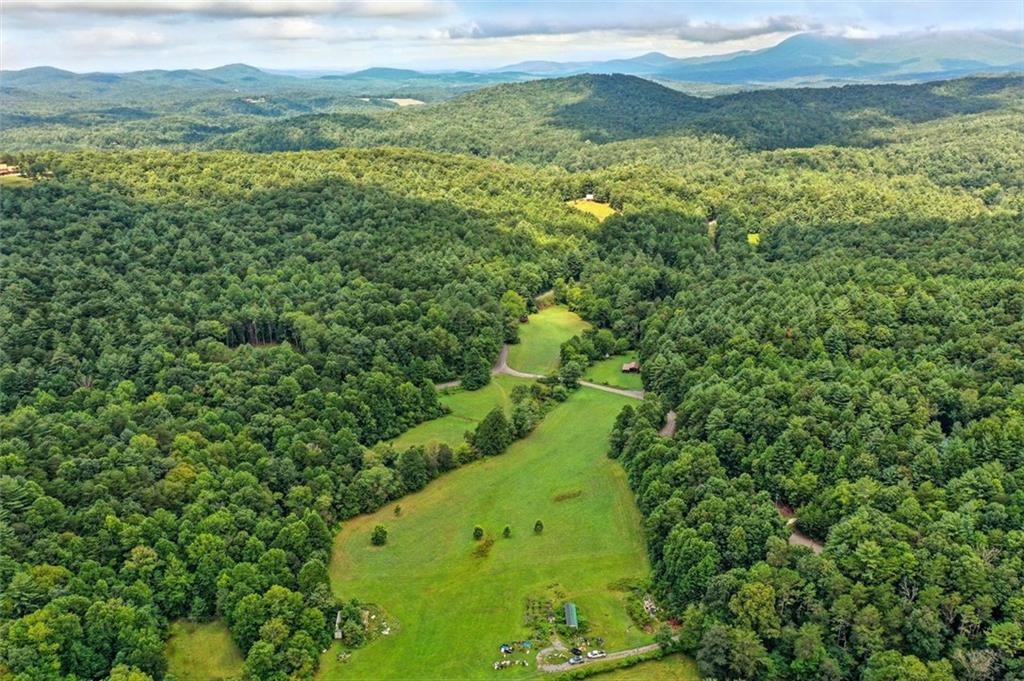 0 Old Bucktown Road Ellijay, GA 30536 - Photo 14 of 26 a view of a lush green hillside and a houses