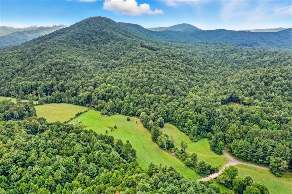0 Old Bucktown Road Ellijay, GA 30536 - Photo 20 of 26 a view of a lush green hillside and a houses