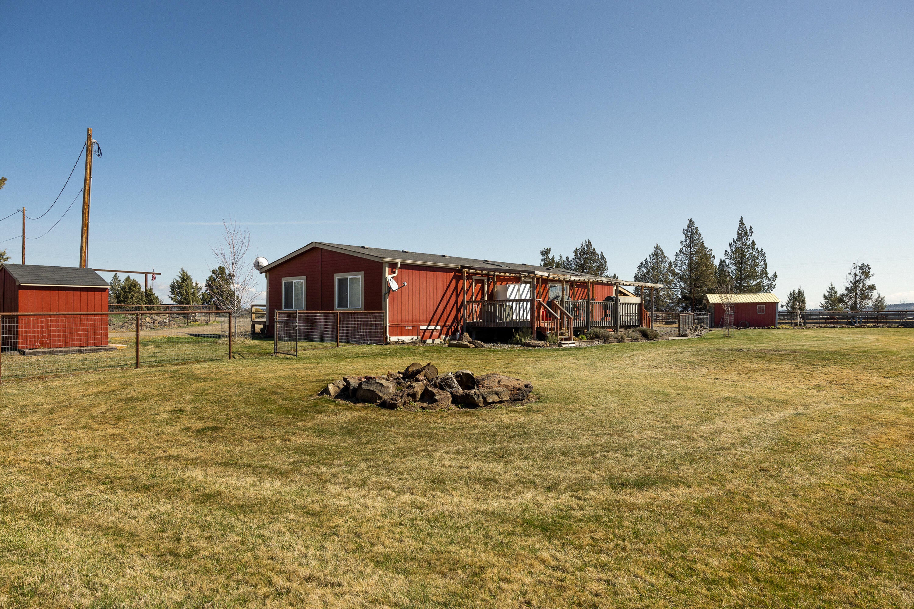 12106 Southwest Houston Lake Road Powell Butte, OR 97753 - Photo 7 of 51 Backyard w/ firepit