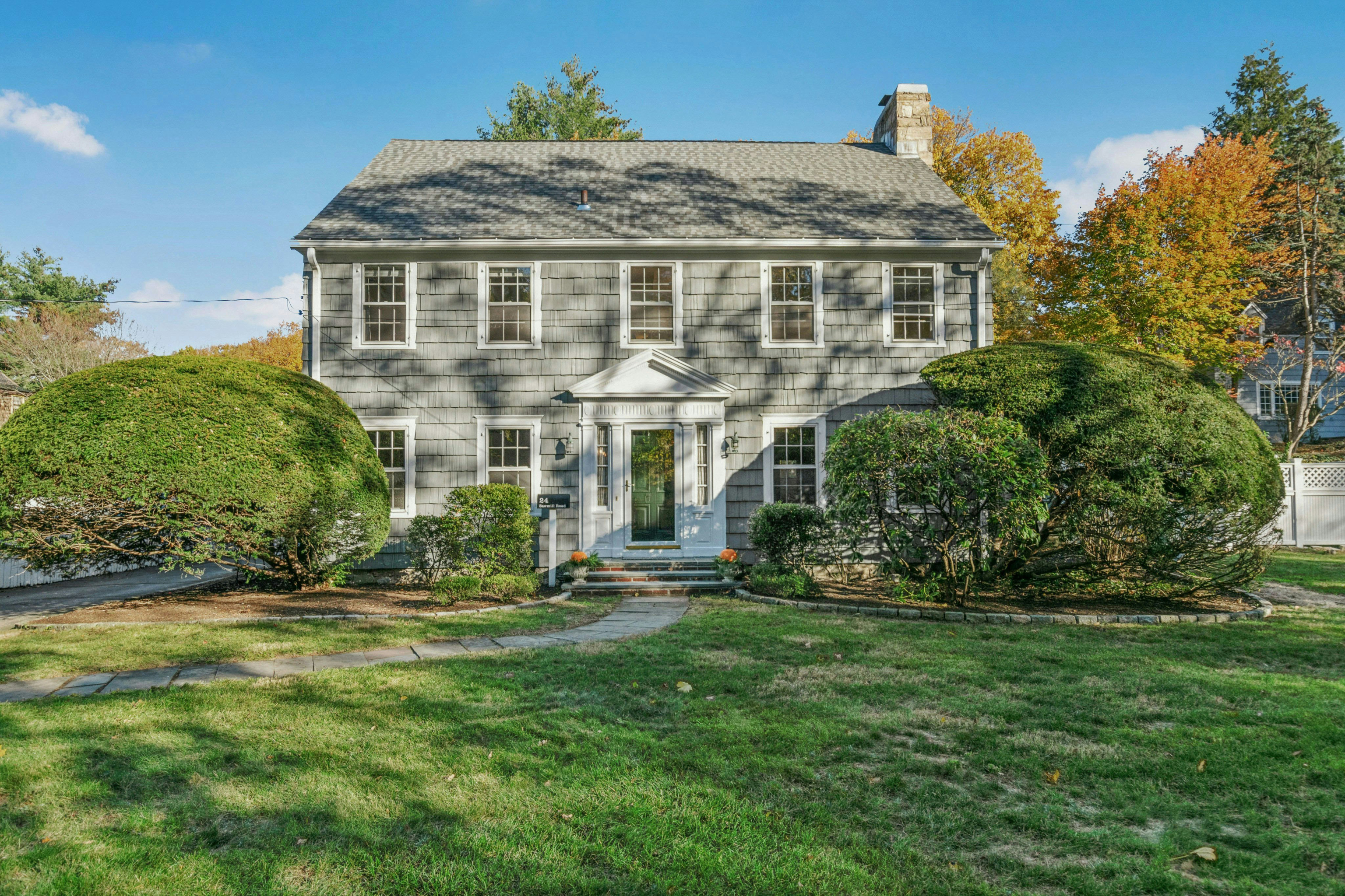 a front view of a house with a yard