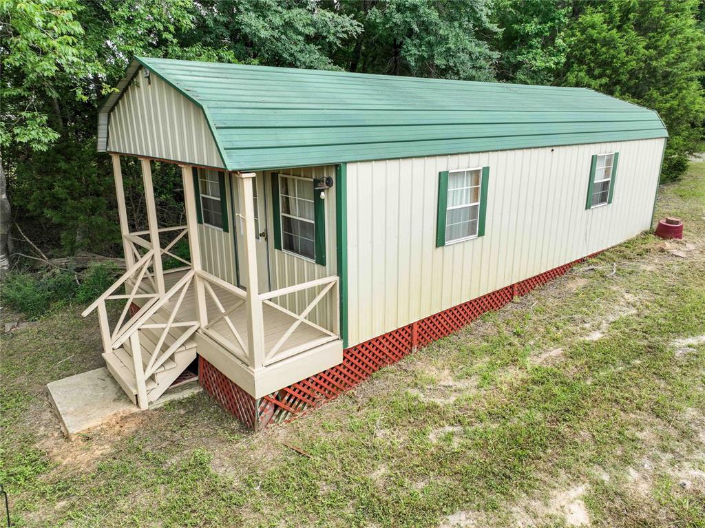 3389 Pvt Road Van, TX 75790 - Photo 28 of 31 a backyard of a house with table and chairs