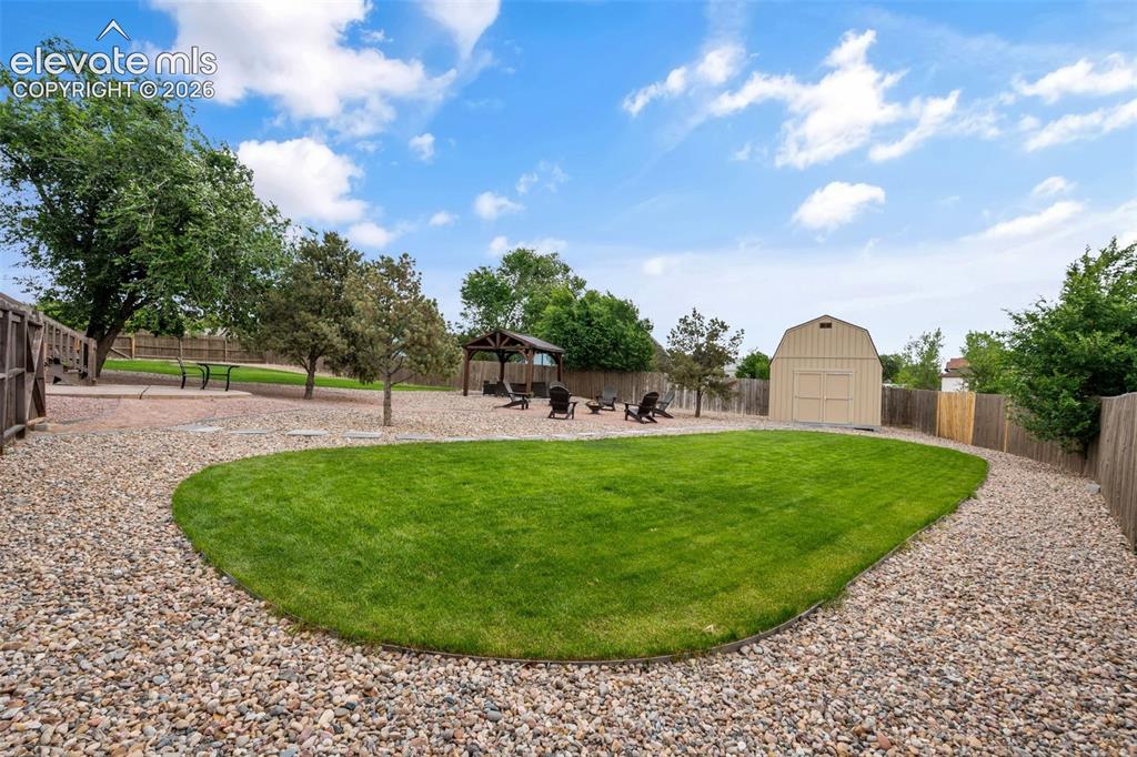 125 Diamond E Road Fountain, CO 80817 - Photo 32 of 43 a view of a golf course with a garden