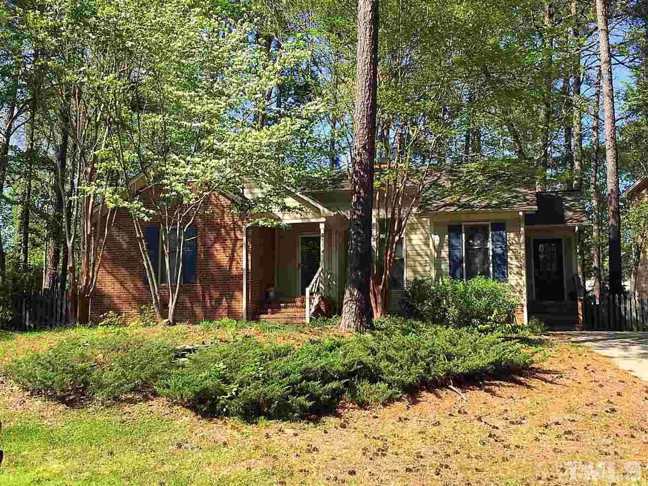 4114 Olde Coach Road Durham, NC 27707 - Photo 1 of 16 a front view of a house with a yard