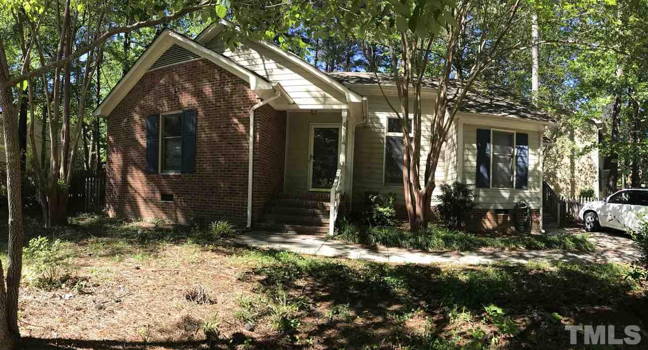 4114 Olde Coach Road Durham, NC 27707 - Photo 2 of 16 a view of a house with a yard