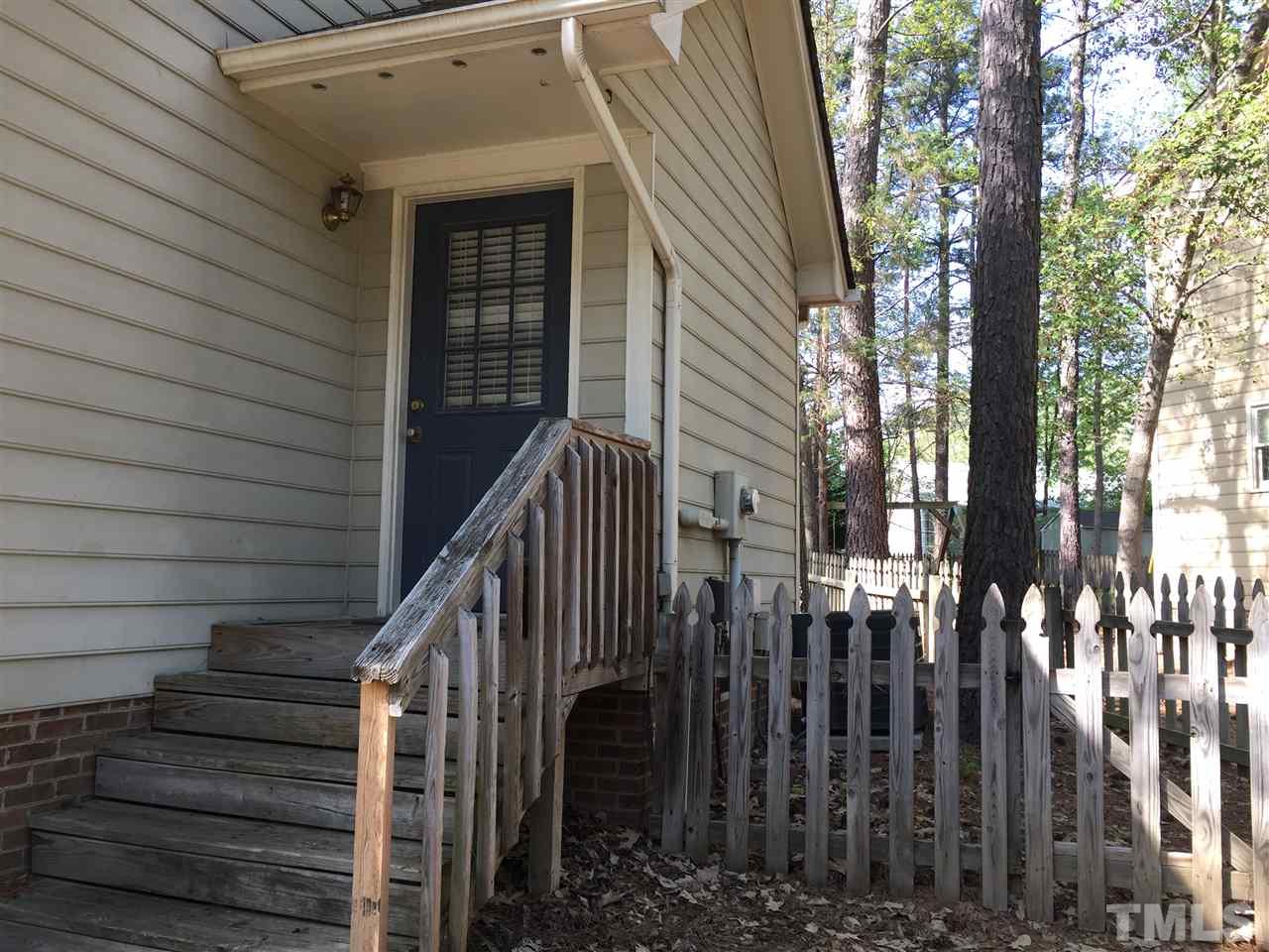 4114 Olde Coach Road Durham, NC 27707 - Photo 14 of 16 a view of a house with wooden fence
