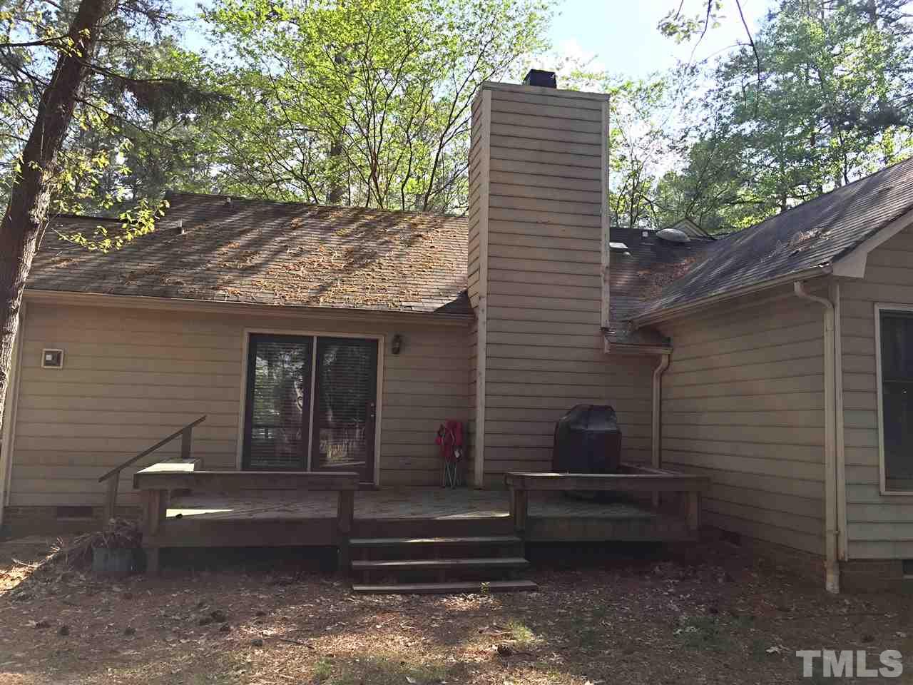 4114 Olde Coach Road Durham, NC 27707 - Photo 15 of 16 a view of a house with a yard and wooden floor