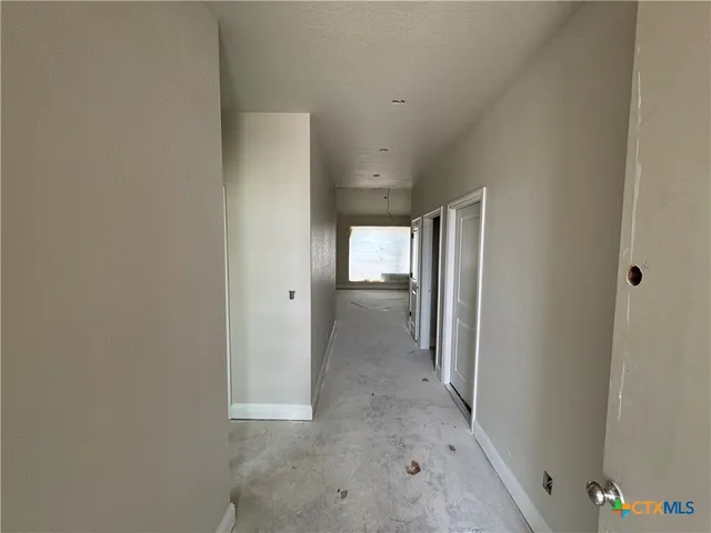a view of hallway with livingroom