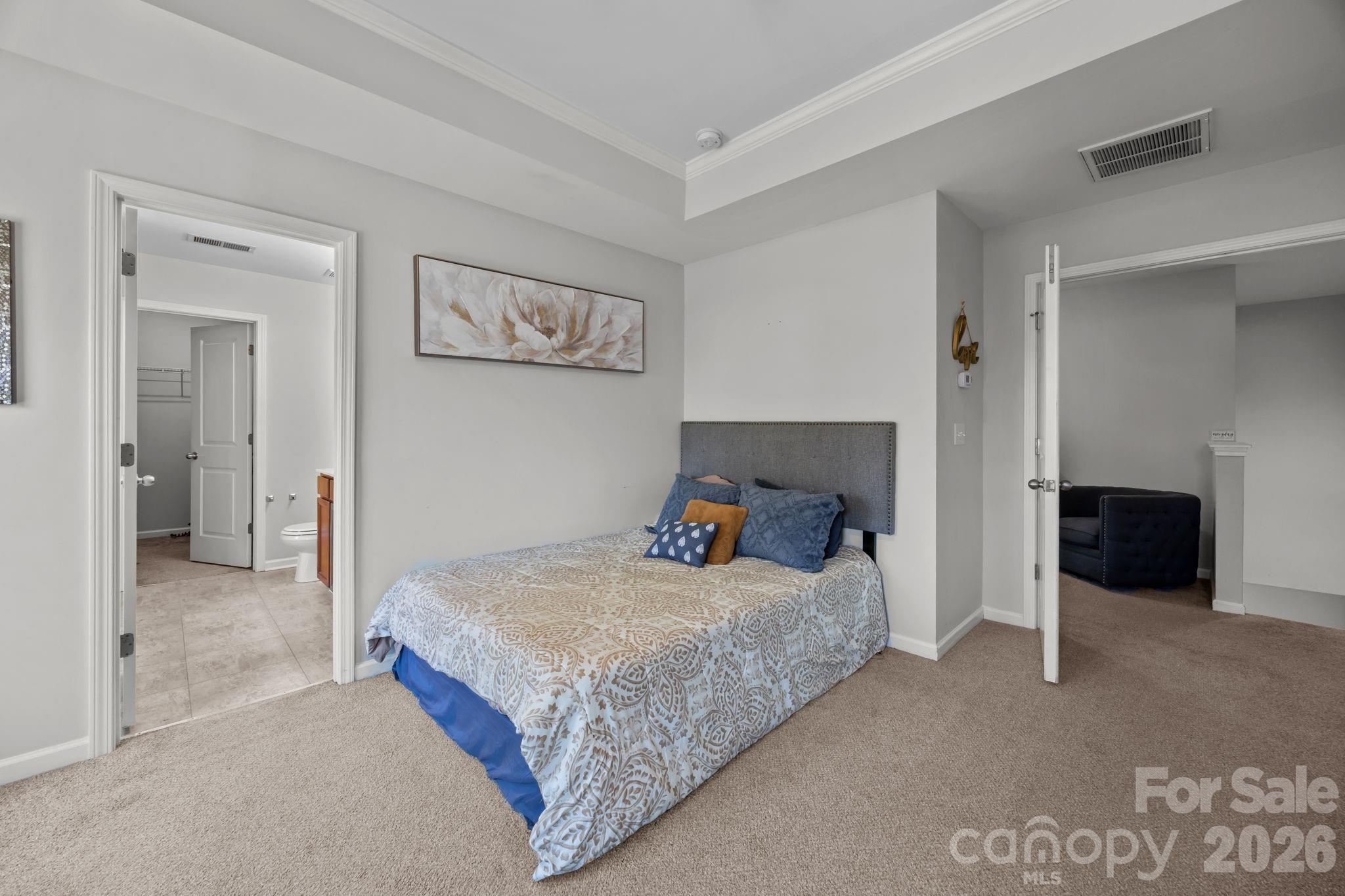 2707 Hunters Moon Lane Matthews, NC 28105 - Photo 15 of 27 a bedroom with a bed and a couch