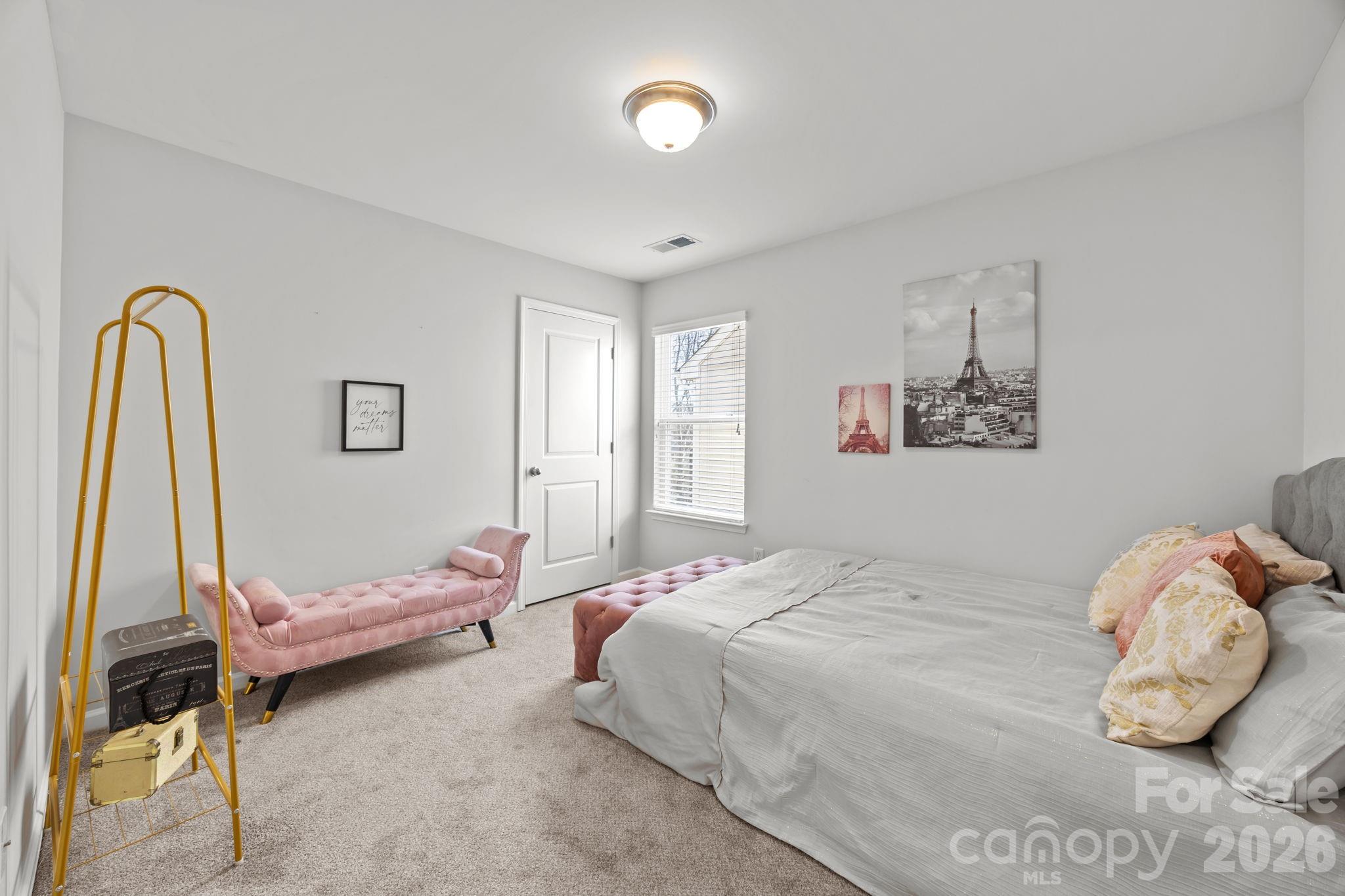 2707 Hunters Moon Lane Matthews, NC 28105 - Photo 19 of 27 a bedroom with a bed and a window