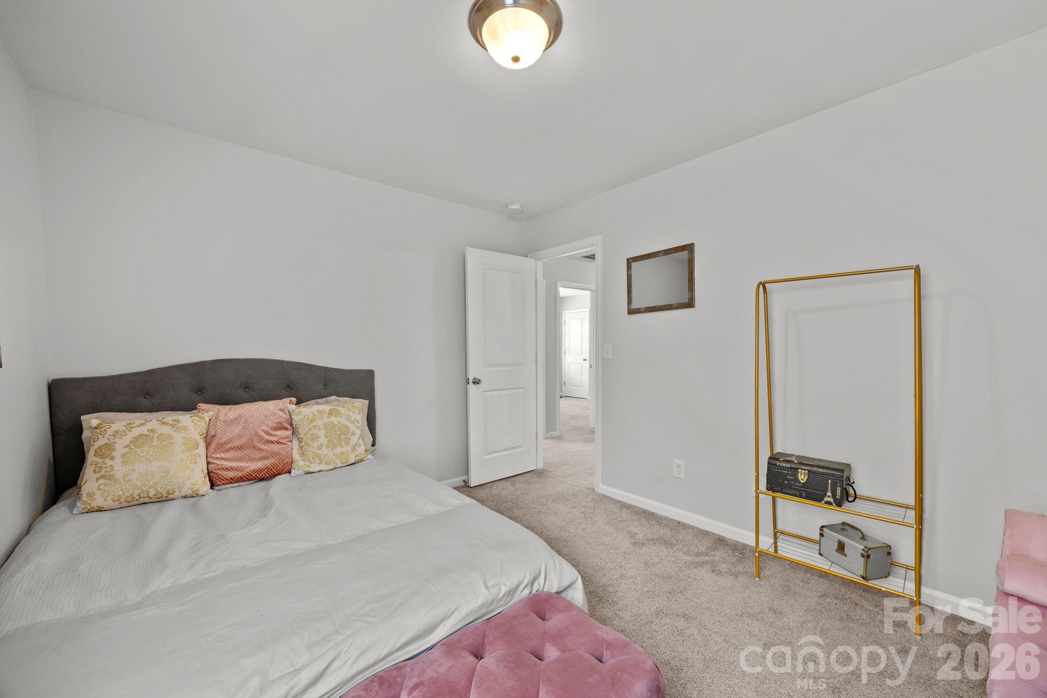2707 Hunters Moon Lane Matthews, NC 28105 - Photo 20 of 27 a bedroom with a bed and a lamp on dresser