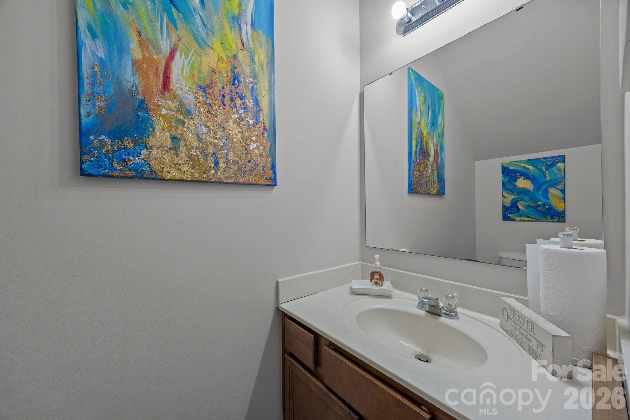 2707 Hunters Moon Lane Matthews, NC 28105 - Photo 21 of 27 a bathroom with a sink mirror and vanity