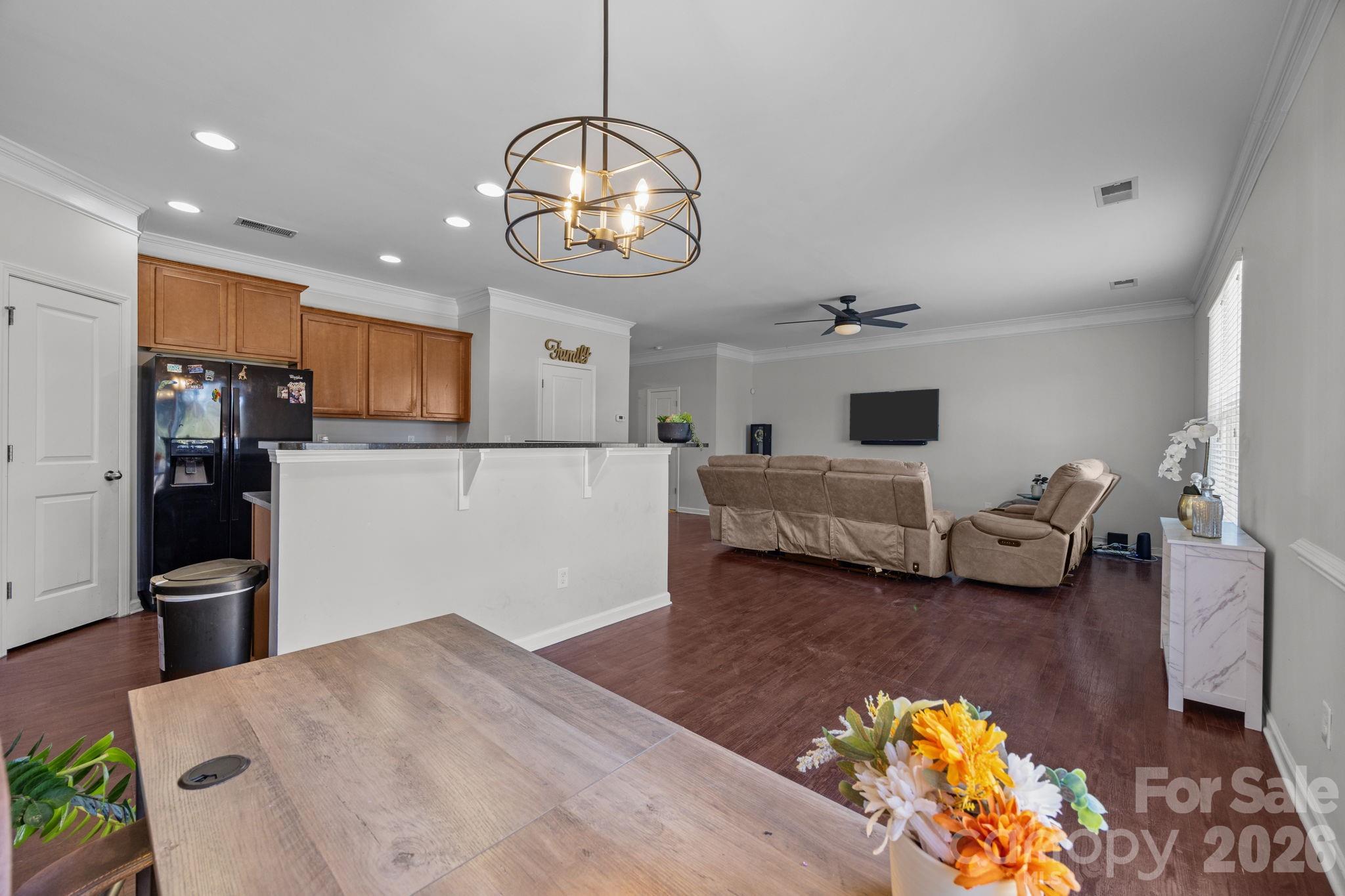 2707 Hunters Moon Lane Matthews, NC 28105 - Photo 24 of 27 a view of a living room and kitchen