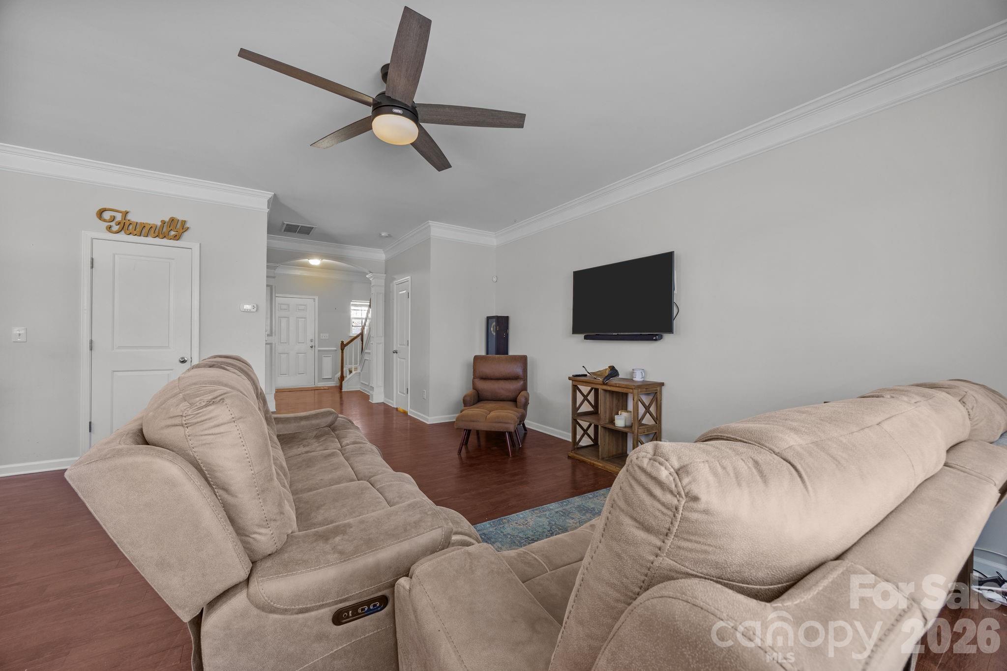 2707 Hunters Moon Lane Matthews, NC 28105 - Photo 25 of 27 a living room with furniture and a flat screen tv