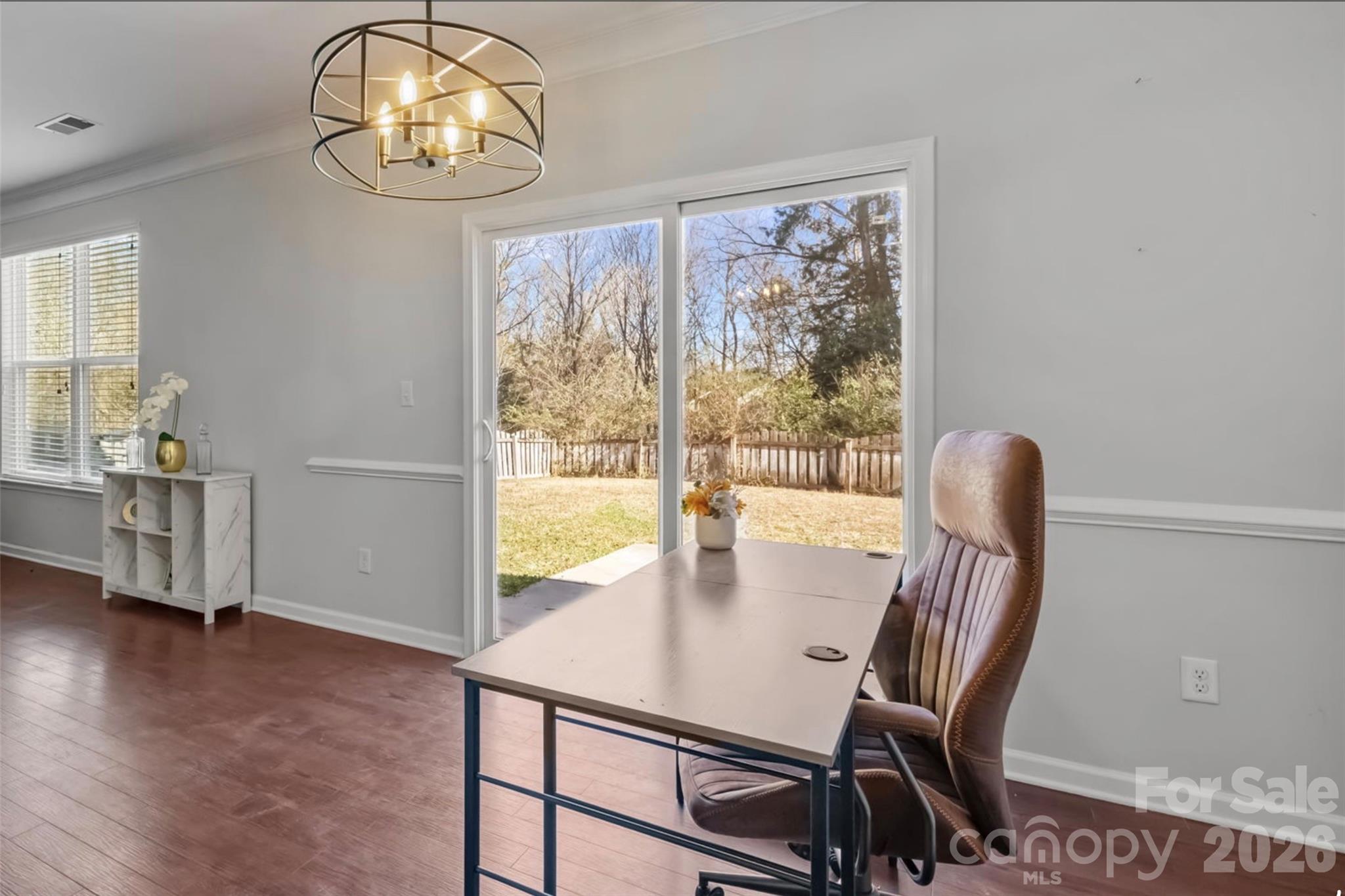 2707 Hunters Moon Lane Matthews, NC 28105 - Photo 5 of 27 a view of a dining room with furniture window and wooden floor