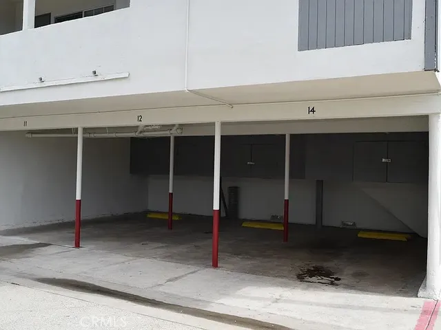 a view of a car park in front of house