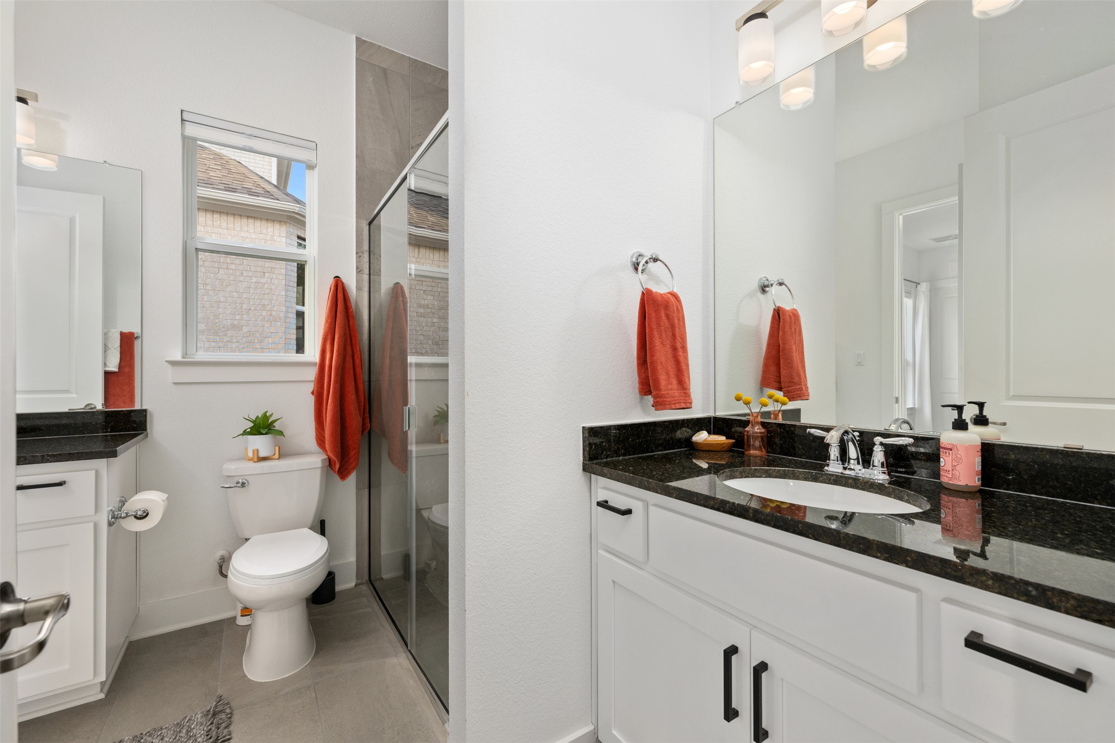 438 Pear Tree Lane Austin, TX 78737 - Photo 20 of 40 Bathroom featuring vanity, a shower stall, and light tile patterned floors