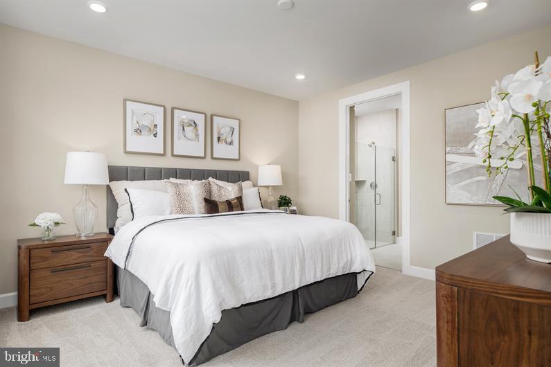 9421 Founders Lane Perry Hall, MD 21128 - Photo 11 of 27 a bedroom with a bed and a painting on the wall