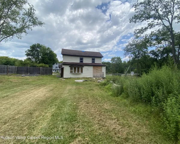 a view of a lake with a tree