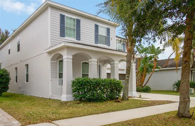 a view of a lake with houses in the back
