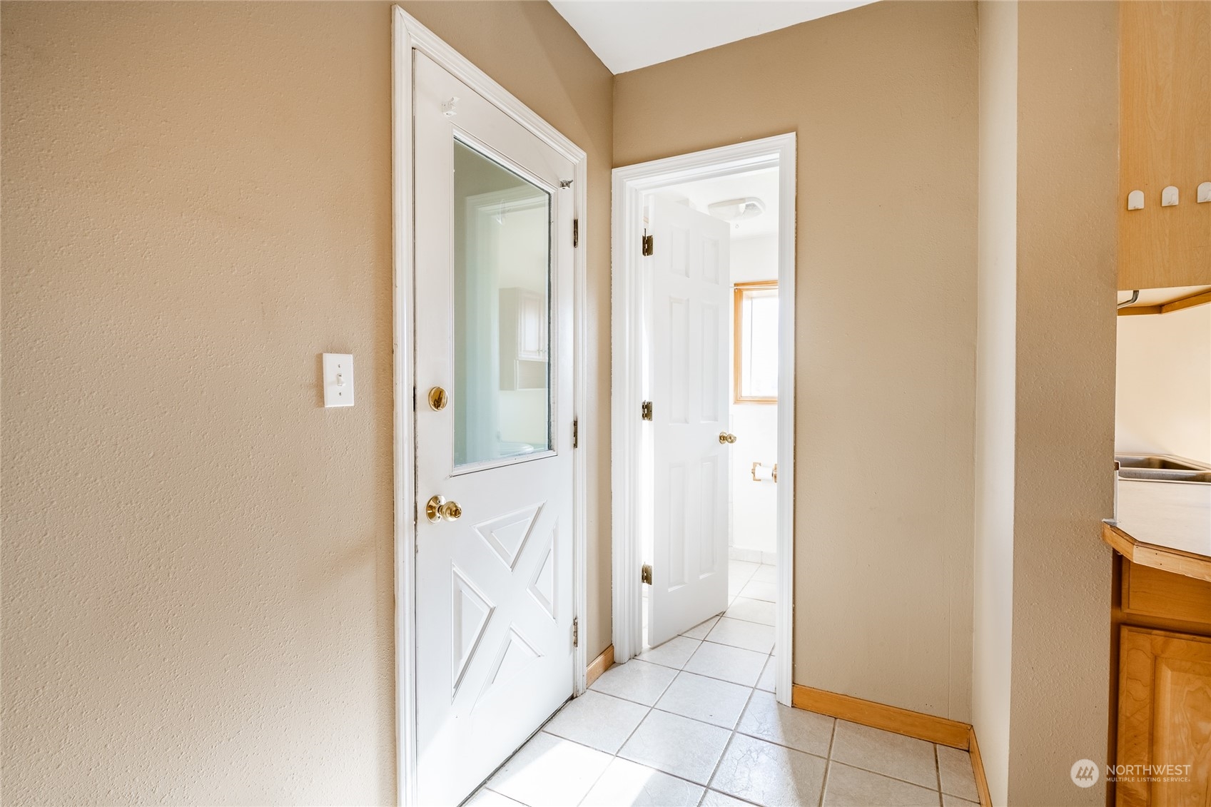 1243 Abbot Road Lynden, WA 98264 - Photo 19 of 40 a view of a bathroom from a corridor