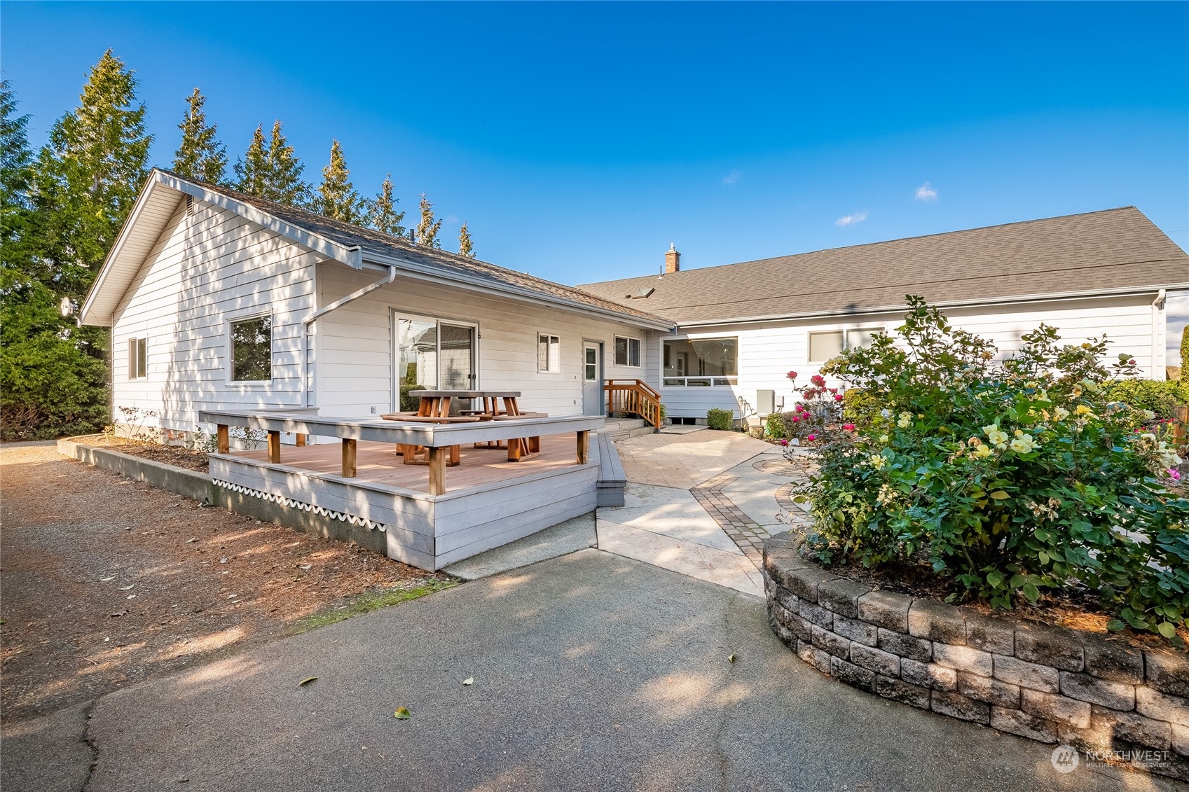 1243 Abbot Road Lynden, WA 98264 - Photo 25 of 40 a view of a patio with couches and table and chairs under an umbrella