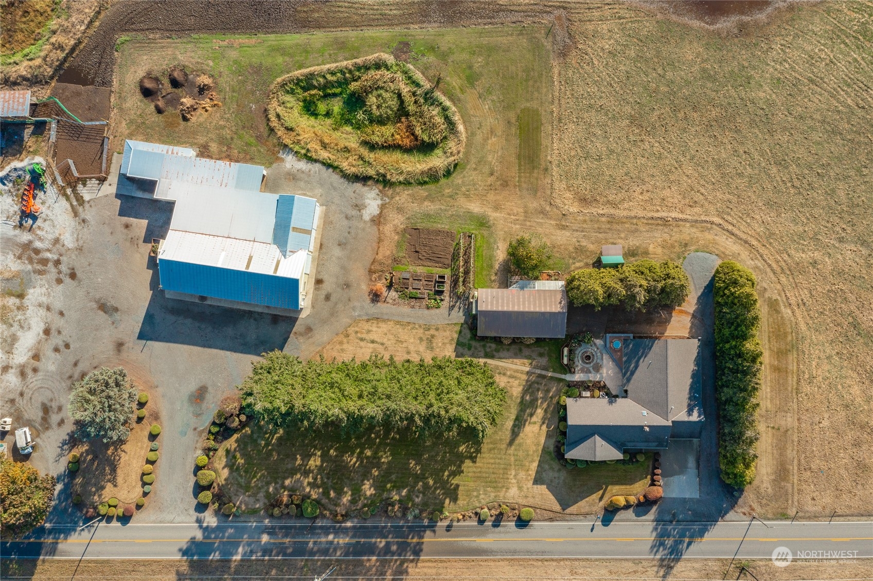 1243 Abbot Road Lynden, WA 98264 - Photo 3 of 40 an aerial view of a fireplace with an outdoor space