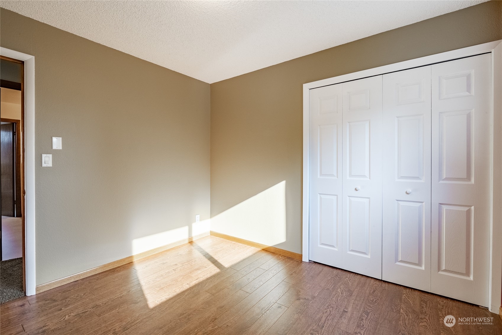 1243 Abbot Road Lynden, WA 98264 - Photo 33 of 40 an empty room with wooden floor and closet