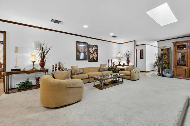 a kitchen with stainless steel appliances kitchen island granite countertop a stove and a refrigerator