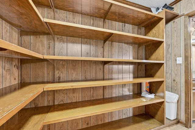 a view of a room with racks on the wall